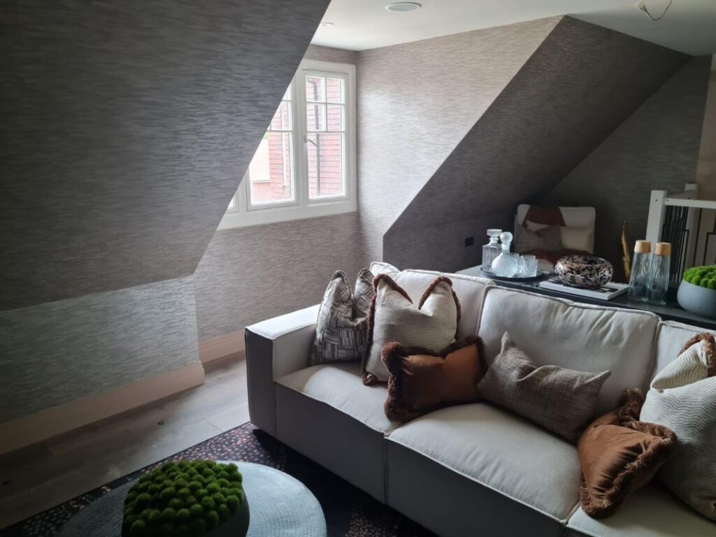 Attic Conversion Living Room with Sloped Ceiling and Cozy Seating Space