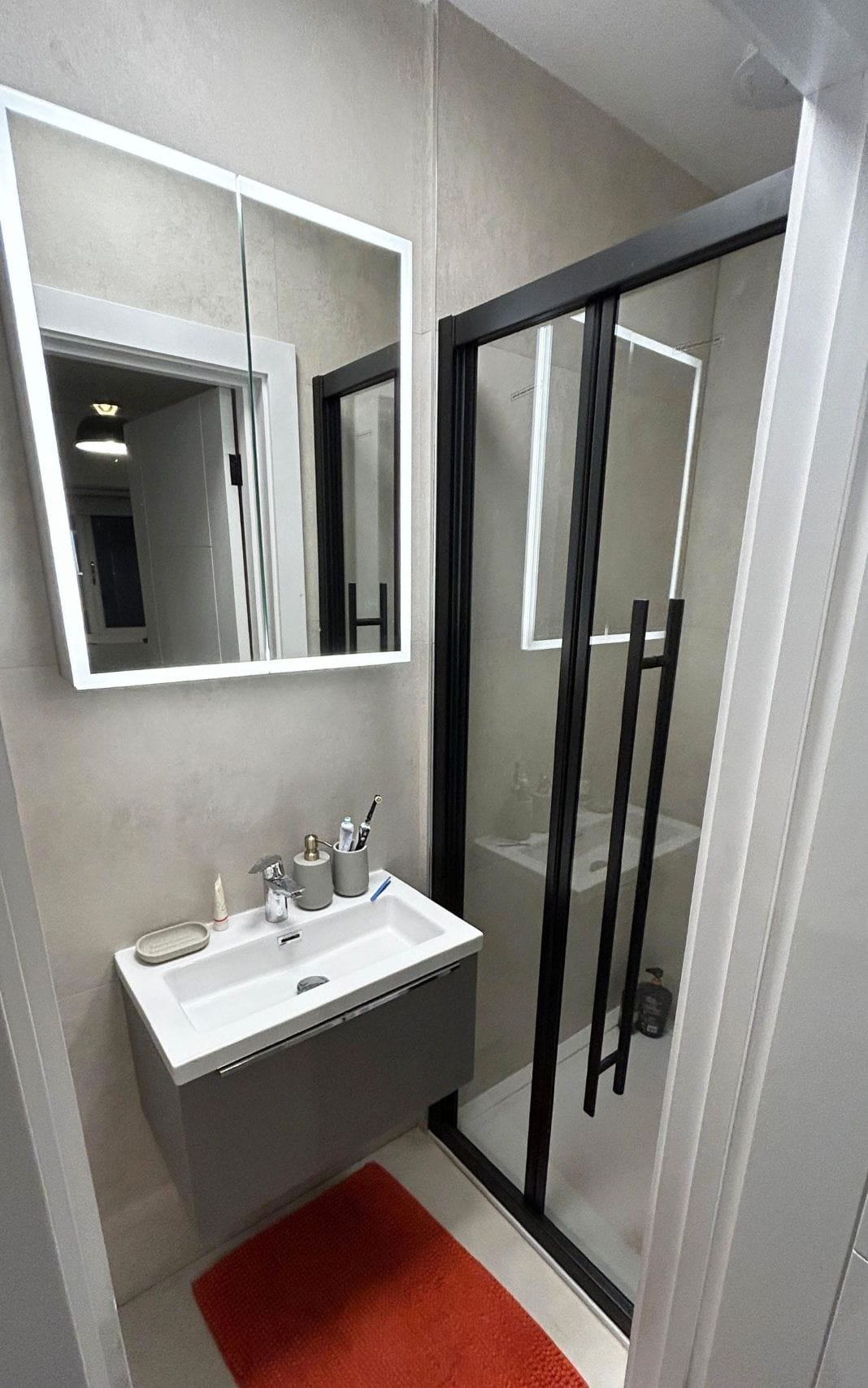Bathroom renovation with mirror in London