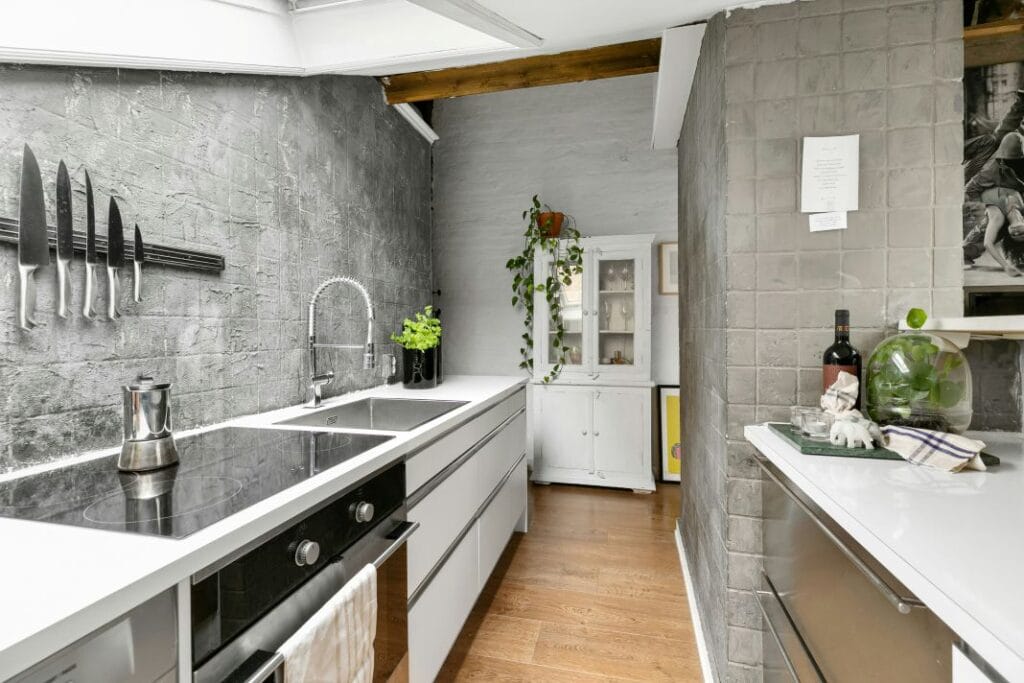 Scandinavian Kitchen Design with White Cabinets, Wooden Accents, and Minimalist Decor