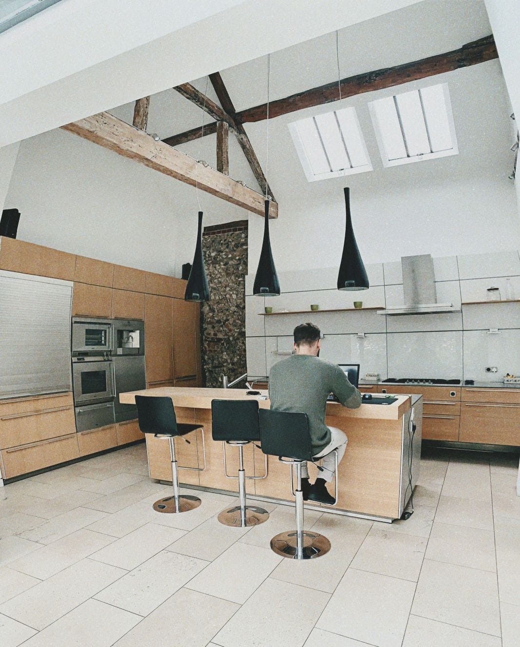 A man working from home in the kitchen