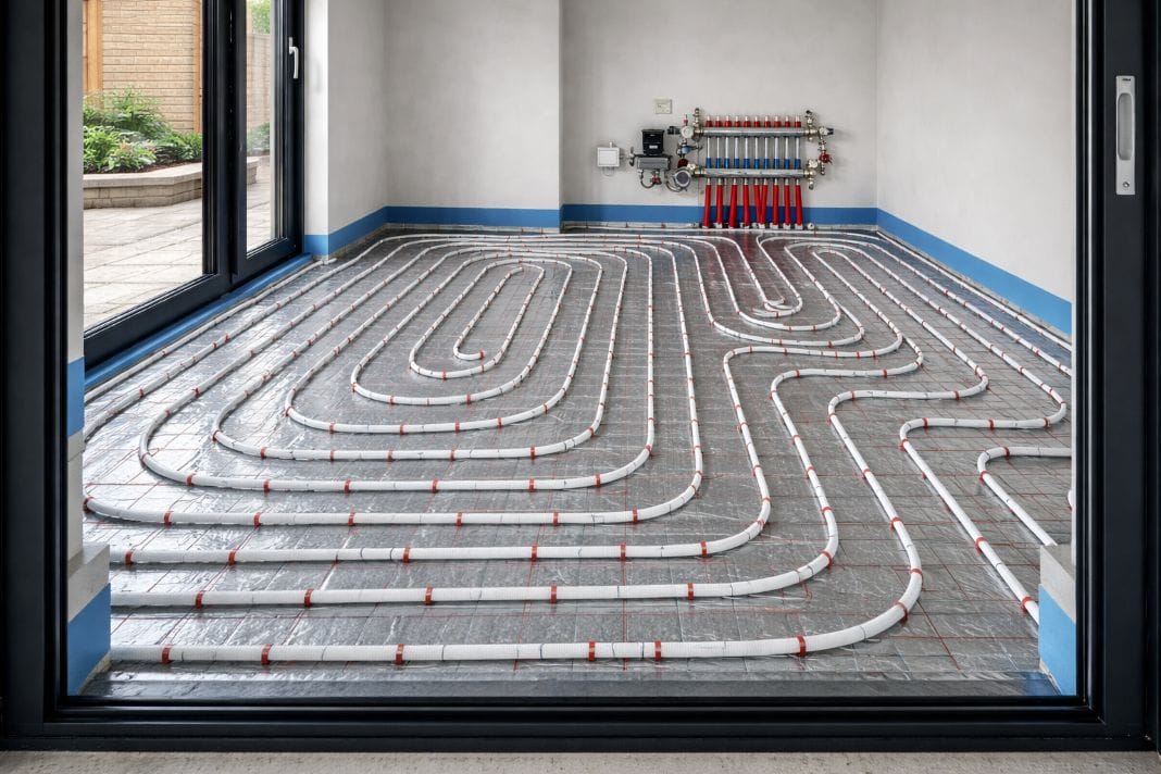 AI image of Professional water-based underfloor heating system with evenly spaced pipework fixed to insulation panels