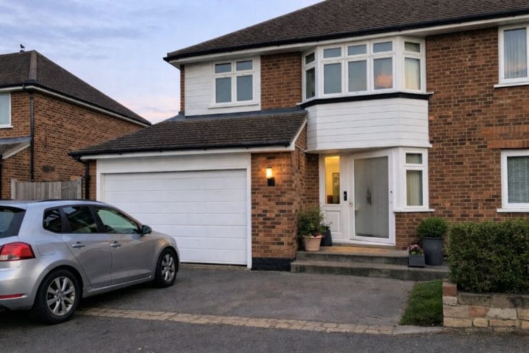an illustrative image of modern London suburban home with an attached garage